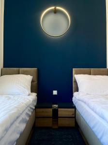 Łóżko lub łóżka w pokoju w obiekcie Narutowicza 5 Apartments