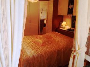 a bedroom with a bed and a white curtain at Guest House Ruža in Dubrovnik