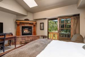 a bedroom with a bed and a fireplace at The Lodges at Deer Valley AB in Park City