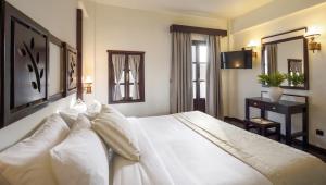 Ένα ή περισσότερα κρεβάτια σε δωμάτιο στο Simantro Resort