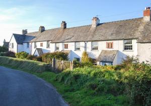 a row of houses on the side of a road at Coastguard Cottage in Blagberry
