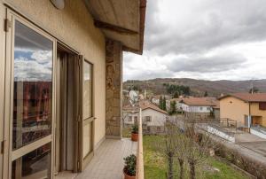 a balcony of a building with a view of a city at La Romana Antica in Madonna di Fornelli