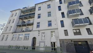 a large white building with solar panels on it at Bright boutique apartment located 15 min from Stephansdom in Vienna