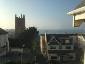 a view of a city with a church and buildings at The White House Hotel in Newquay