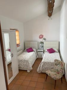 Postel nebo postele na pokoji v ubytování New Ca de na volta - tra Liguria e Toscana