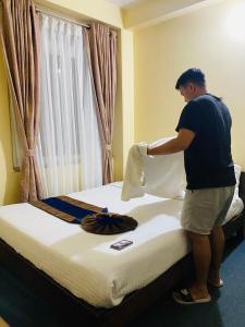 Postel nebo postele na pokoji v ubytování Pokhara Eco Friendly Home