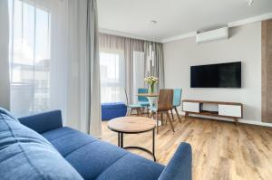 Televisyen dan/atau pusat hiburan di Let's Sea - City Apartments