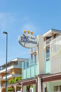 a hotel batam sign on the side of a building at Hotel Bahamas in Lido di Savio