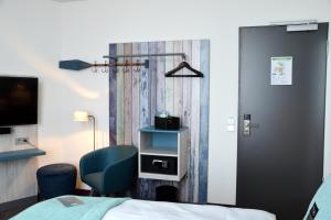 Postel nebo postele na pokoji v ubytování Holiday Inn - the niu, Rig Lübeck by IHG