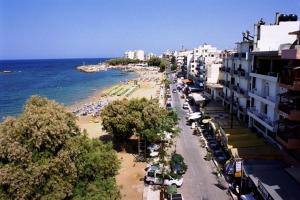a view of a beach with buildings and the ocean at Nea Elena Apartments in Chania