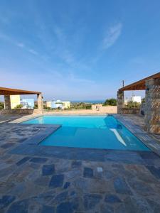 a swimming pool in a villa with a view at Villa Milan 1 mit Padelplatz in Kos