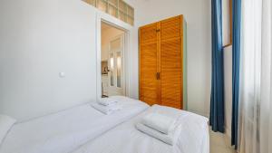 Posteľ alebo postele v izbe v ubytovaní Apartamenty Sun & Snow Traugutta Plaża