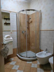 a bathroom with a shower and a toilet and a sink at Casa del Duca Portoferraio in Portoferraio