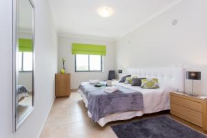 Giường trong phòng chung tại Apartamento Palmeiras