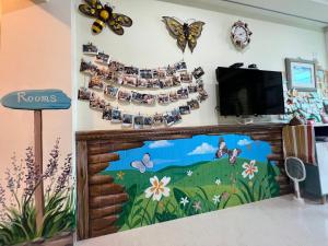 Una televisión o centro de entretenimiento en Yu Shou Hao Hsien Guesthouse