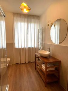 a bathroom with a sink and a mirror at Maison Bon Ton in Villafranca dʼAsti +51 photos