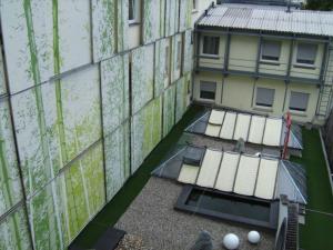 an overhead view of a building with windows and a building at Hotel Erbprinzenhof in Karlsruhe