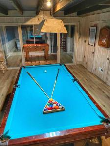 a blue pool table with balls on top of it at Blake House Historic Estate with Private Inn in Centreville