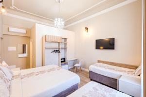 Łóżko lub łóżka w pokoju w obiekcie Hotel Bijou Roof Terrace