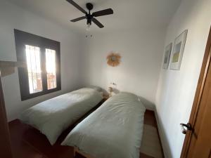 Posteľ alebo postele v izbe v ubytovaní Casa Pura Vida - Malaga - Andalusië
