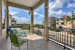 a balcony with chairs and a view of the ocean at Ocean Vue By Beachside Management in Siesta Key