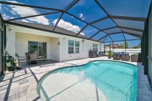 an indoor swimming pool with a glass roof at VILLA AWESOME! in Cape Coral