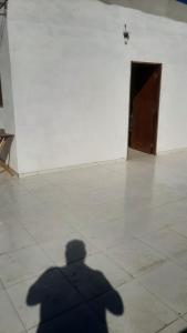 a shadow of a person standing in a room at Rooftop na lagoa in Jijoca de Jericoacoara