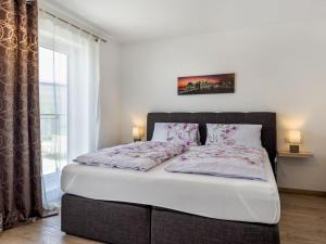 Un pat sau paturi într-o cameră la Amsel - Vogelhaus