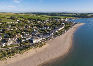 an aerial view of a beach with houses at Waterside Cottage Westleigh in Westleigh