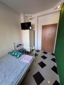 Postel nebo postele na pokoji v ubytování GuestHouse