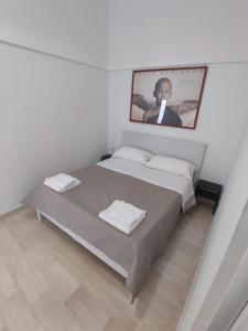 Postel nebo postele na pokoji v ubytování Le case di Roberto