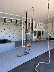 a room with a climbing gym with a climbing wall at Zeltāres in Jelgava