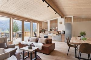 a living room with a couch and a table at Ferienhäuser Gerhart in Haus im Ennstal
