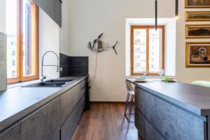 A kitchen or kitchenette at Piccola Venezia Canal View Charming Flat