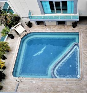 an overhead view of a swimming pool in a building at Hotel Panorama in Sincelejo