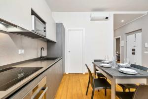 a kitchen with a table and a dining room at Yellove in La Spezia
