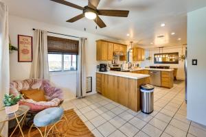 a kitchen with a ceiling fan and a table at Yuma Vacation Rental with Private Pool and Patio! in Yuma