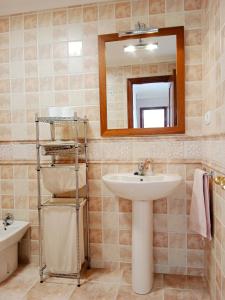 a bathroom with a sink and a mirror at El Mirador 2 in Viveiro +21 photos