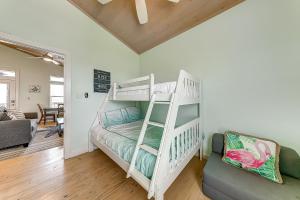 a room with a bunk bed and a couch at Eskridge Gem Unit B in Port Aransas