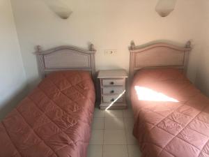 Postel nebo postele na pokoji v ubytování VERACOAST 09