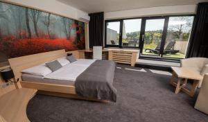 Ένα ή περισσότερα κρεβάτια σε δωμάτιο στο Hotel Kras