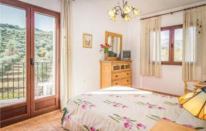 a bedroom with a bed and a window at Spacious villa with private pool near Priego de Cordoba in Priego de Córdoba +24 photos