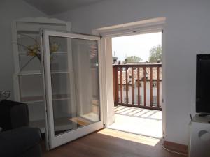 a sliding glass door leading to a balcony at Casa all'Oca in Riva del Garda