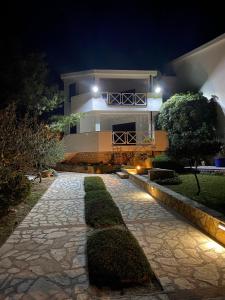 a house at night with a walkway in front at Villa Eugenia in Košljun
