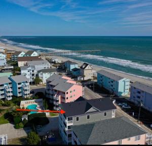an aerial view of a beach with buildings and the ocean at Swanky Seahorse in Carolina Beach