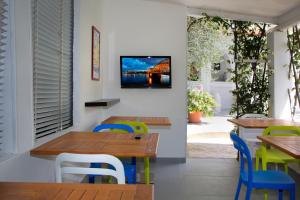 Телевизор и/или развлекательный центр в Baia Marticana Residence Hotel
