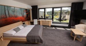 Ένα ή περισσότερα κρεβάτια σε δωμάτιο στο Hotel Kras