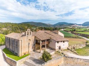 an aerial view of a house with a church at Santuario Virgen de la Fuente in Peñarroya de Tastavins