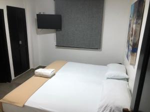 Postel nebo postele na pokoji v ubytování Hotel Tayromar