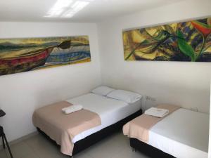 Postel nebo postele na pokoji v ubytování Hotel Tayromar